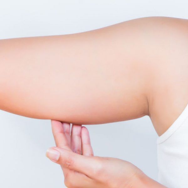 asian woman showing her fat upper arm